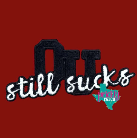 Still Sucks Iron-On Embroidered Patch
